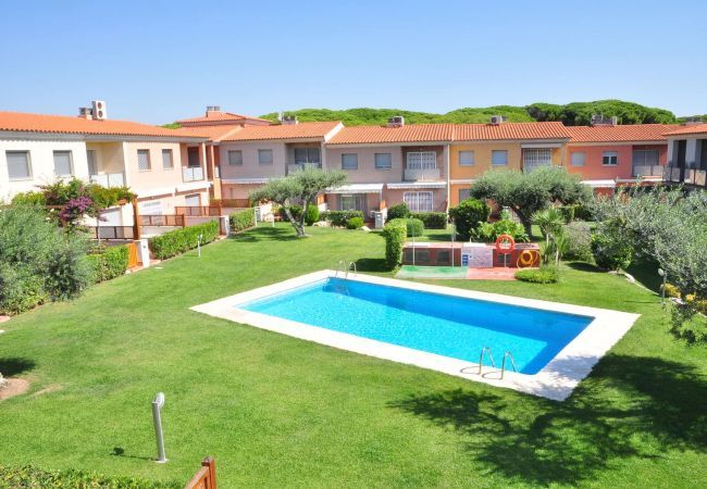 Pool with garden at Tarongers house on the Costa Dorada Garden area with swimming pool of tourist accommodation in Cambrils